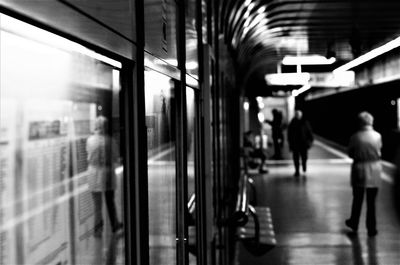 People in train at railroad station