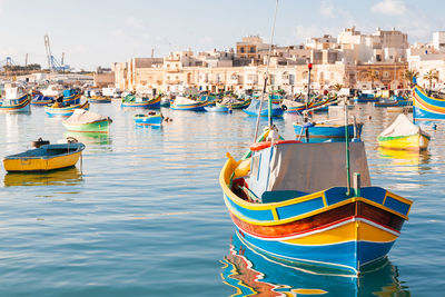 Colorful boats - mediterranean  fisherman village in the south east of malta. marsaxlokk, malta.