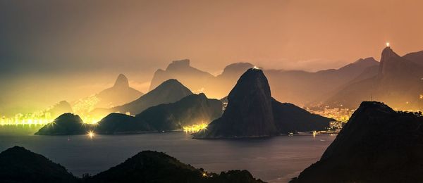 Panoramic view of mountains against sky during sunset