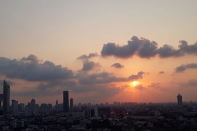 Cityscape against sky during sunset