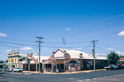 Street against clear blue sky