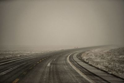 Empty road against sky