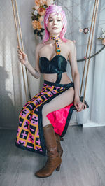 Portrait of young woman sitting on chair
