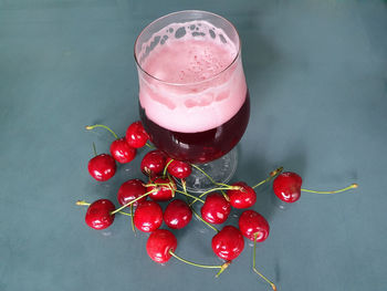 High angle view of red berries on table