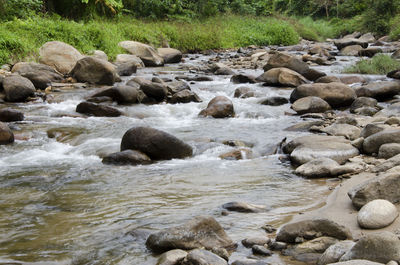 Scenic view of pebbles in river