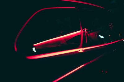 Close-up of illuminated car on street at night