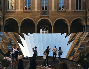 Group of people in front of buildings