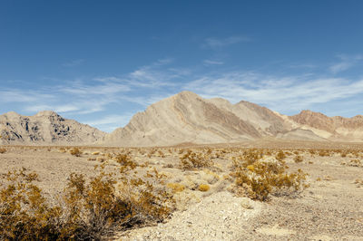 Scenic view of arid landscape against sky