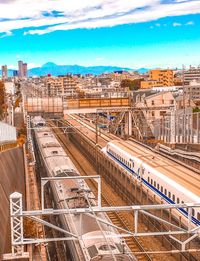 High angle view of train in city against sky