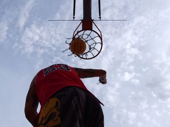 Low angle view of basketball hoop against sky