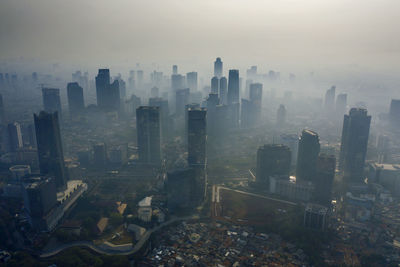 High angle view of buildings in city against sky