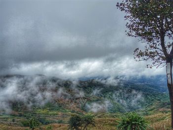 Scenic view of storm clouds over landscape