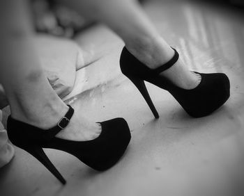 High angle view of human hand holding paper