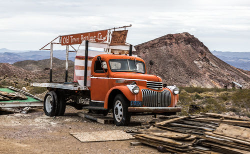 Truck on mountain against sky