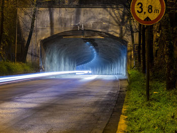  a closeup of a highway tunnel with a light trail