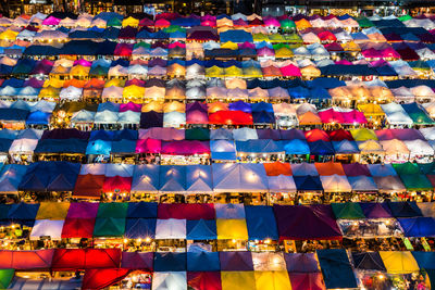 High angle view of colorful illuminated tents in market