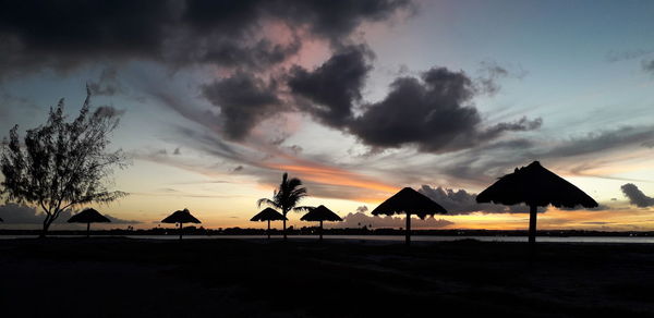 Scenic view of beach against sky during sunset