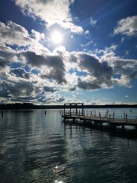 Pier over sea against sky