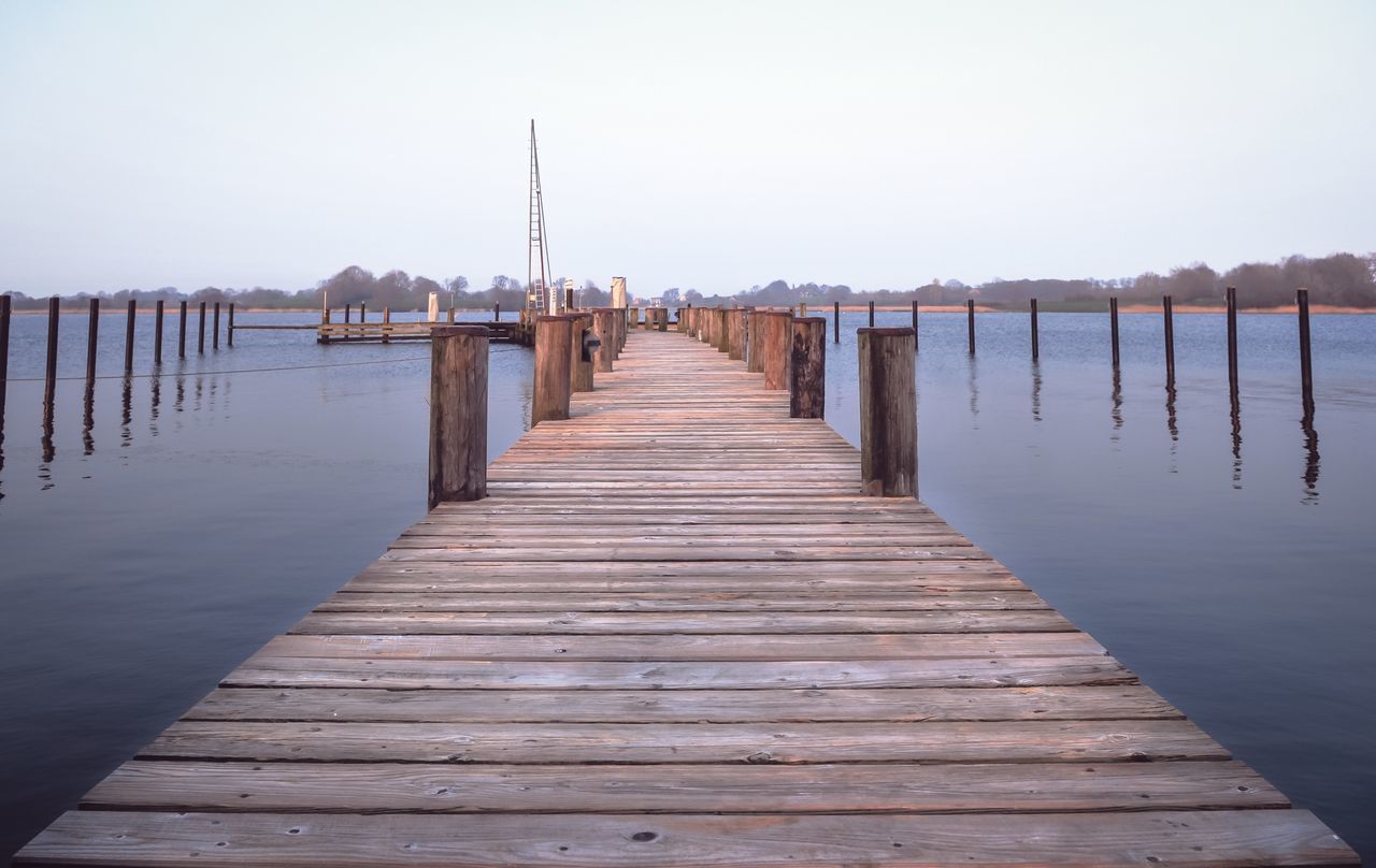 water, pier, wood - material, sky, the way forward, direction, wooden post, post, sea, architecture, built structure, scenics - nature, tranquil scene, nature, tranquility, no people, jetty, diminishing perspective, in a row, wood, wood paneling, outdoors, long