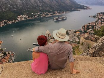 Rear view of people looking at river