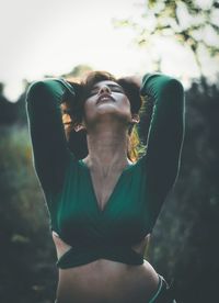 Young woman looking up