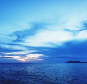 Scenic view of sea against blue sky