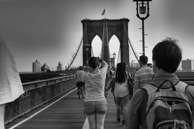 Tourists walking on bridge