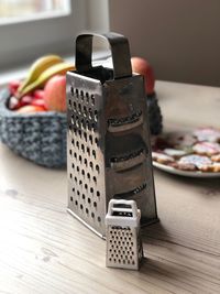 Close-up of graters on table