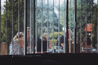 People looking through window