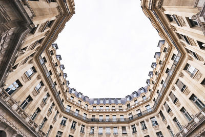 France, ile-de-france, paris, low angle view of apartments surrounding square edouard-vii