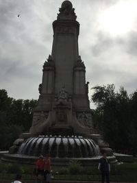 Low angle view of statue against cloudy sky