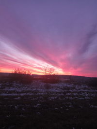 Scenic view of silhouette landscape against sky during sunset