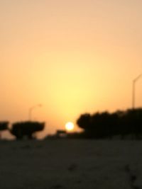 Silhouette landscape against sky during sunset