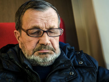 Thoughtful man siting in train