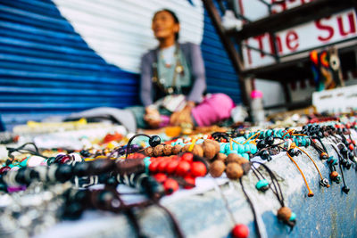 Low angle view of multi colored bracelets at market stall