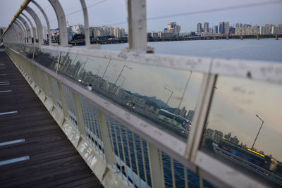 View of pier in city against sky