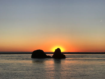 Scenic view of sea against sky during sunset