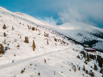 Scenic view of snowcapped mountains against sky