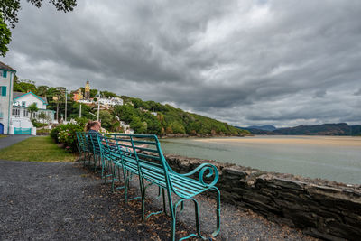 Scenic view of sea and mountains against sky