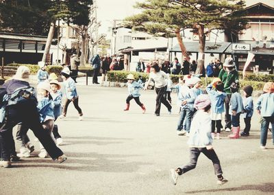 School children running on playground