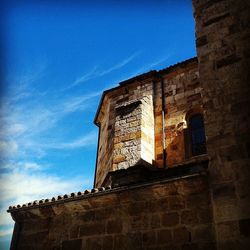 Low angle view of building against blue sky