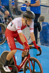 Rear view of men with bicycle