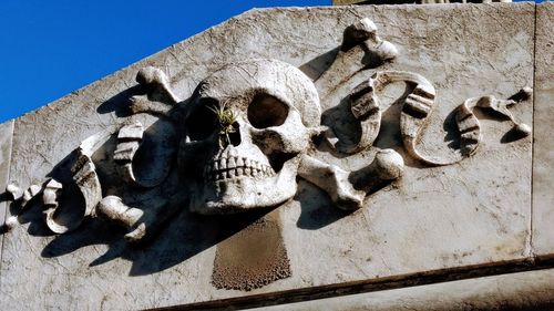 Low angle view of statue against building