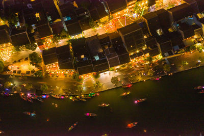 High angle view of illuminated city buildings at night