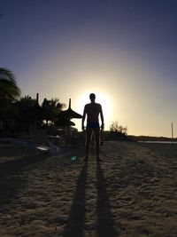 Silhouette of woman at sunset