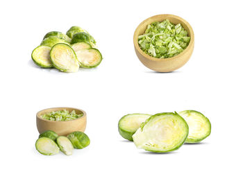 Close-up of green fruits against white background