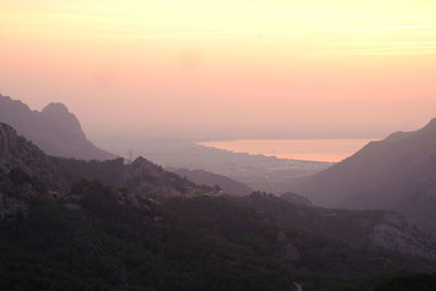 Scenic view of mountains against sky during sunset