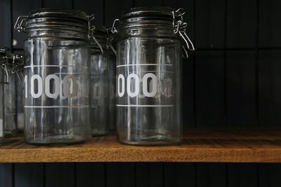 Close-up of glass jars on table