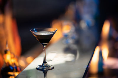 Close-up of wine glasses on table