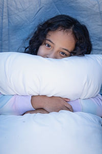 Young woman sleeping on bed at home